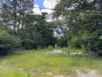 Photo of Mobile Home Lot Recently Vacated, Prior Utilities in Place